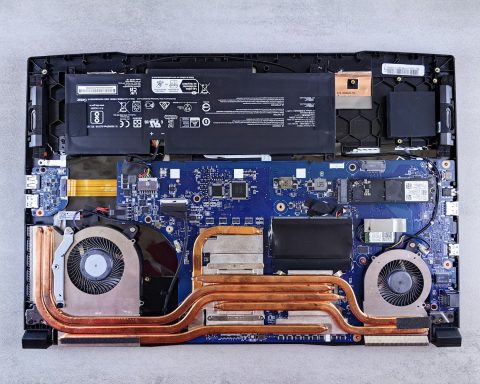 the motherboard of a laptop is being dismantled