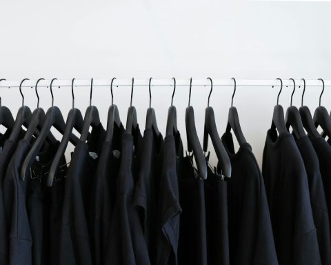 black clothes hanged in rack