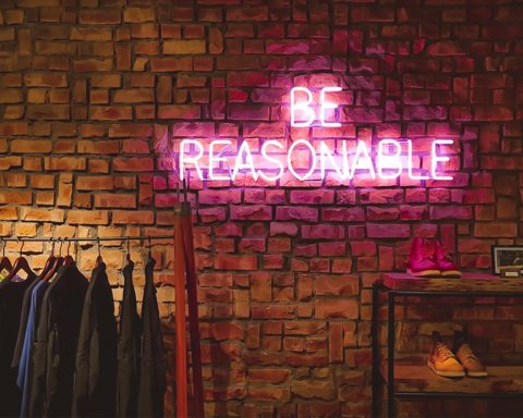 Be Reasonable neon signage