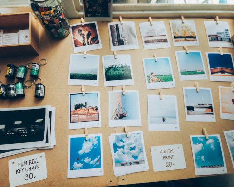 assorted photos on beige wooden table
