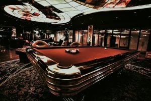a pool table in the middle of a room