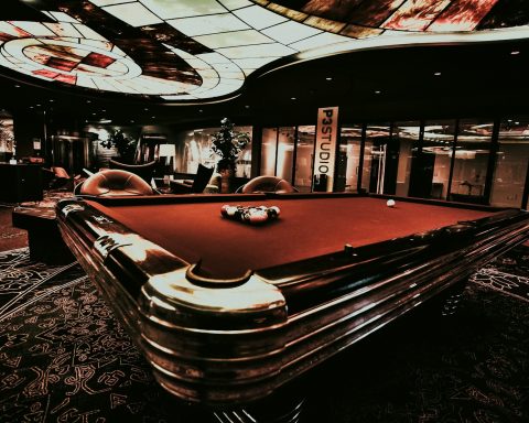 a pool table in the middle of a room