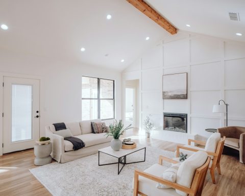 a living room filled with furniture and a fire place