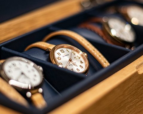 gold and white analog watch