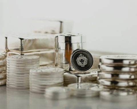a stack of silver containers sitting on top of a table