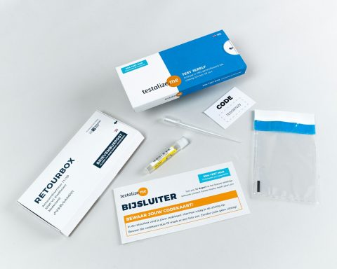 a white table topped with medical supplies and a package